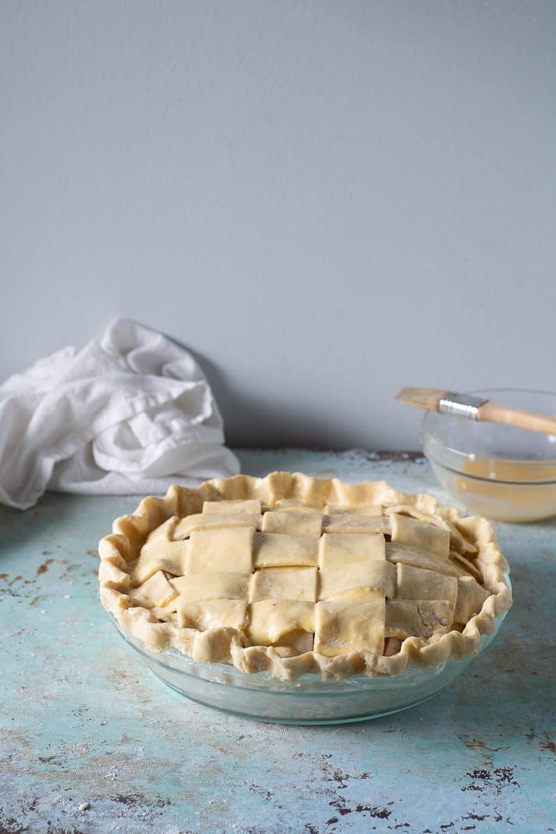 Unbaked apple pie, brushed with pie wash