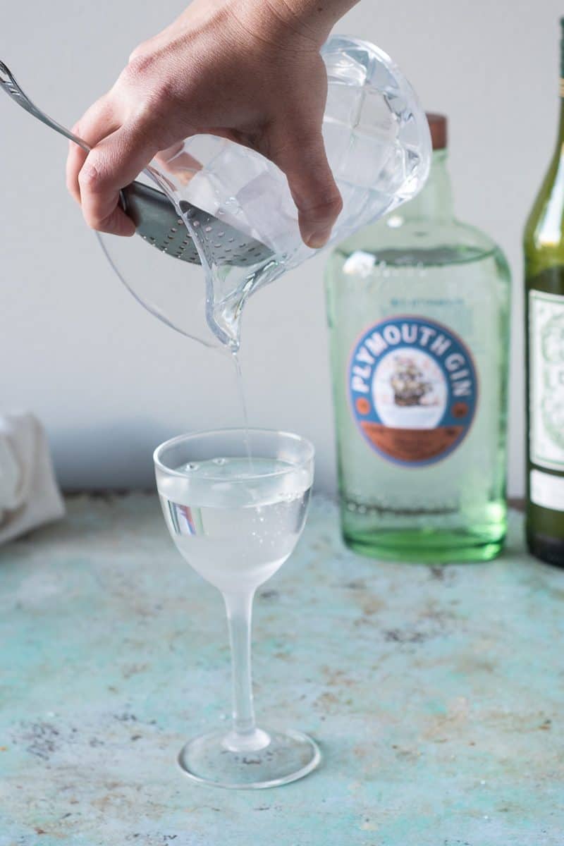 Straining a Dry Martini into a Nick and Nora glass