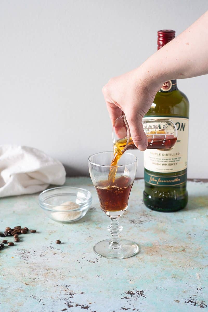 Hot coffee poured into an Irish coffee glass