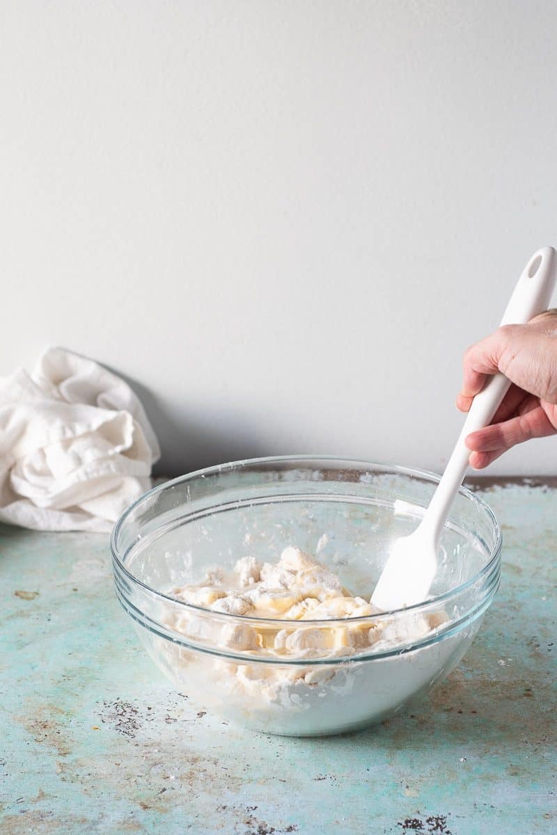 Stirring water into the flour and butter mixture