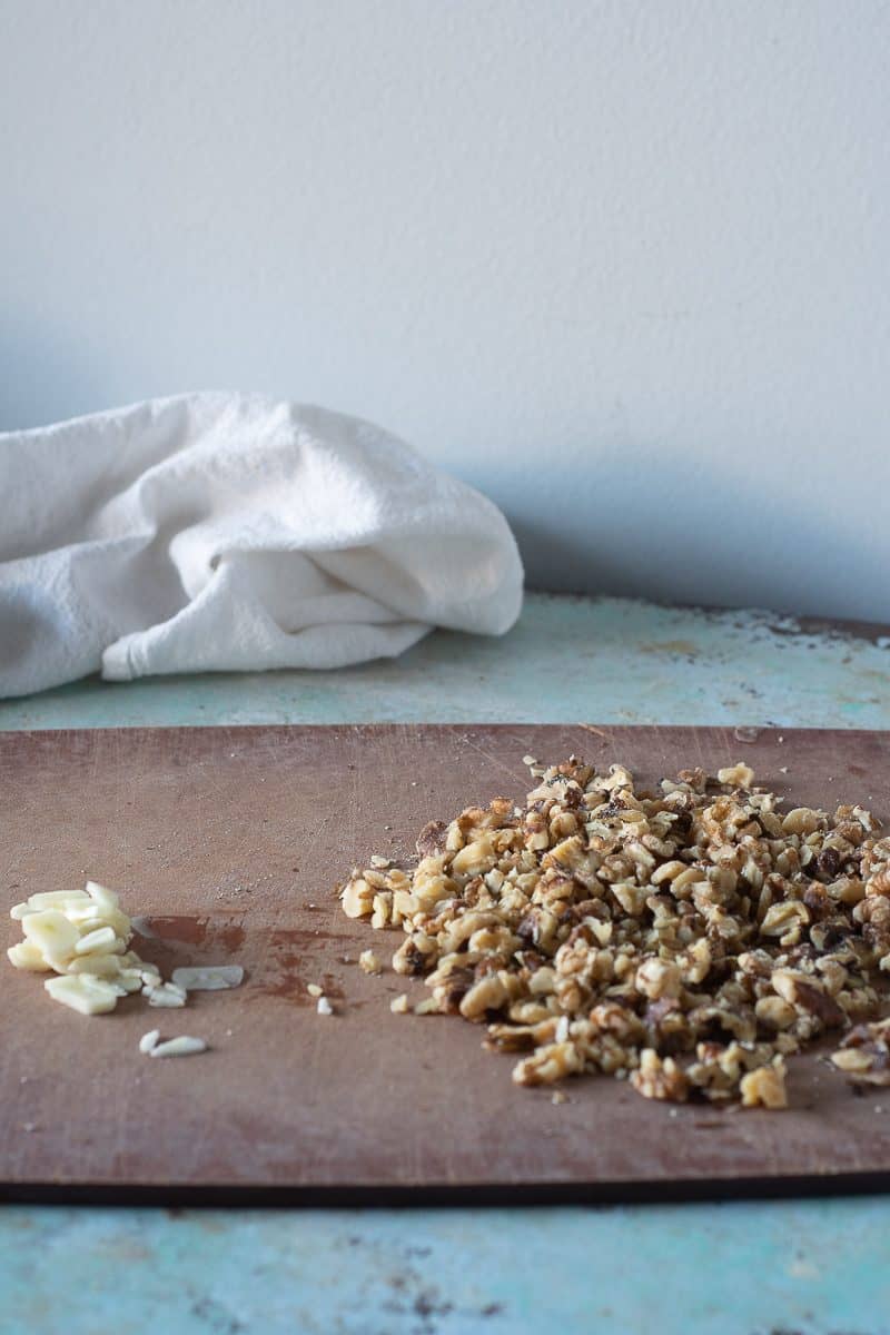 Thinly sliced garlic cloves and roughly chopped walnuts