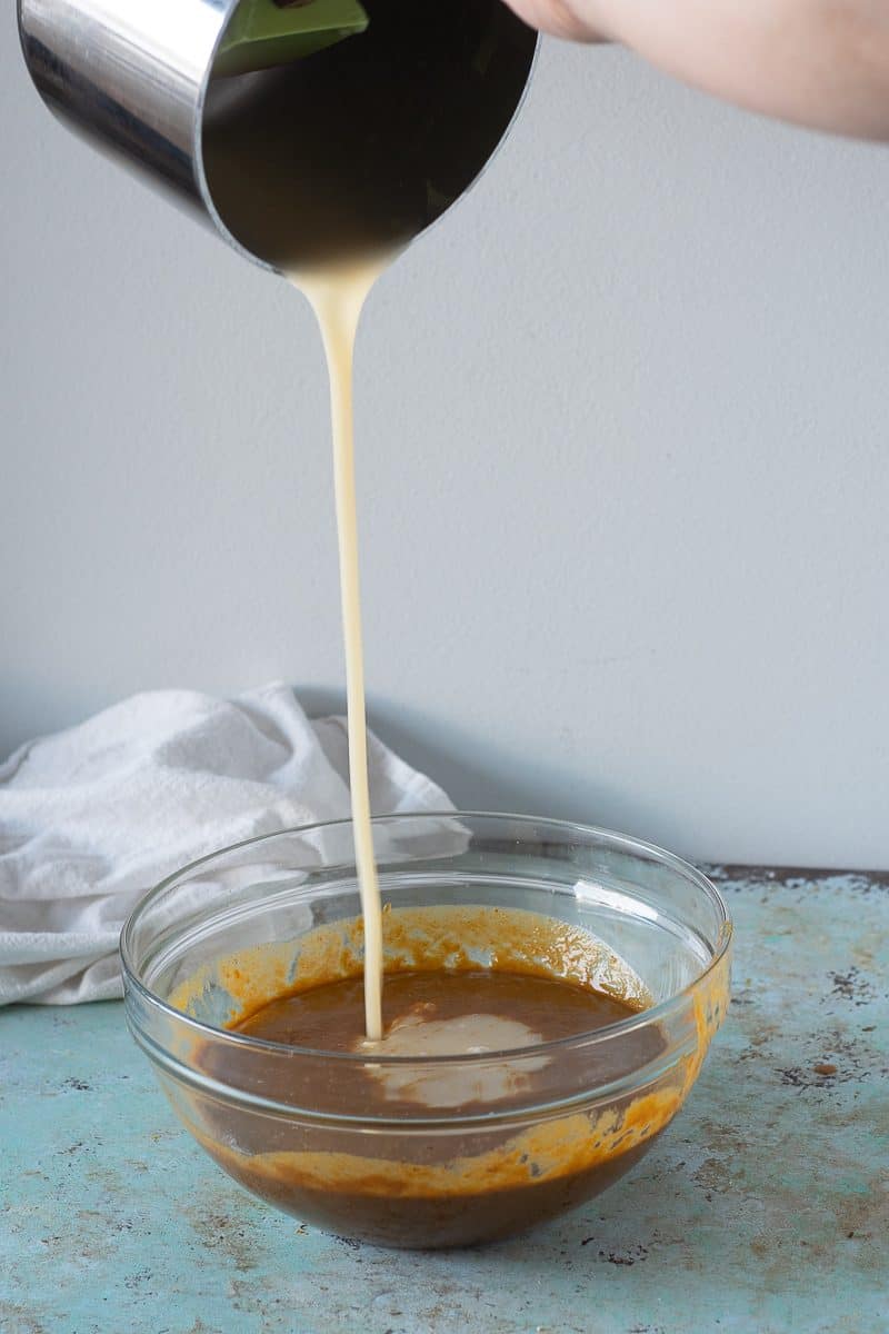 Pouring caramel into the pumpkin mixture
