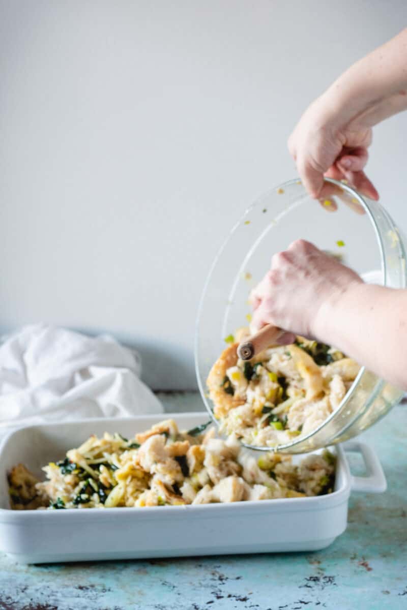 Adding stuffing mixture to baking dish