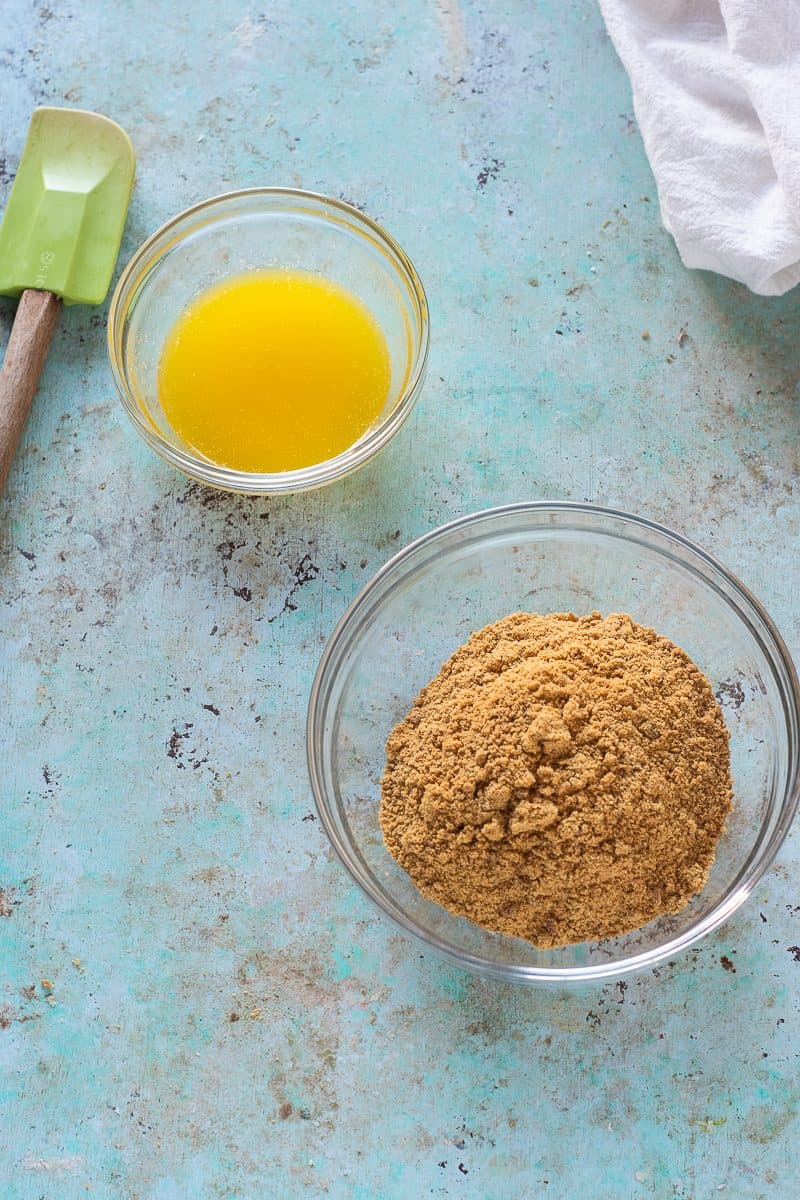 Gingersnap crumbs and melted butter in bowls