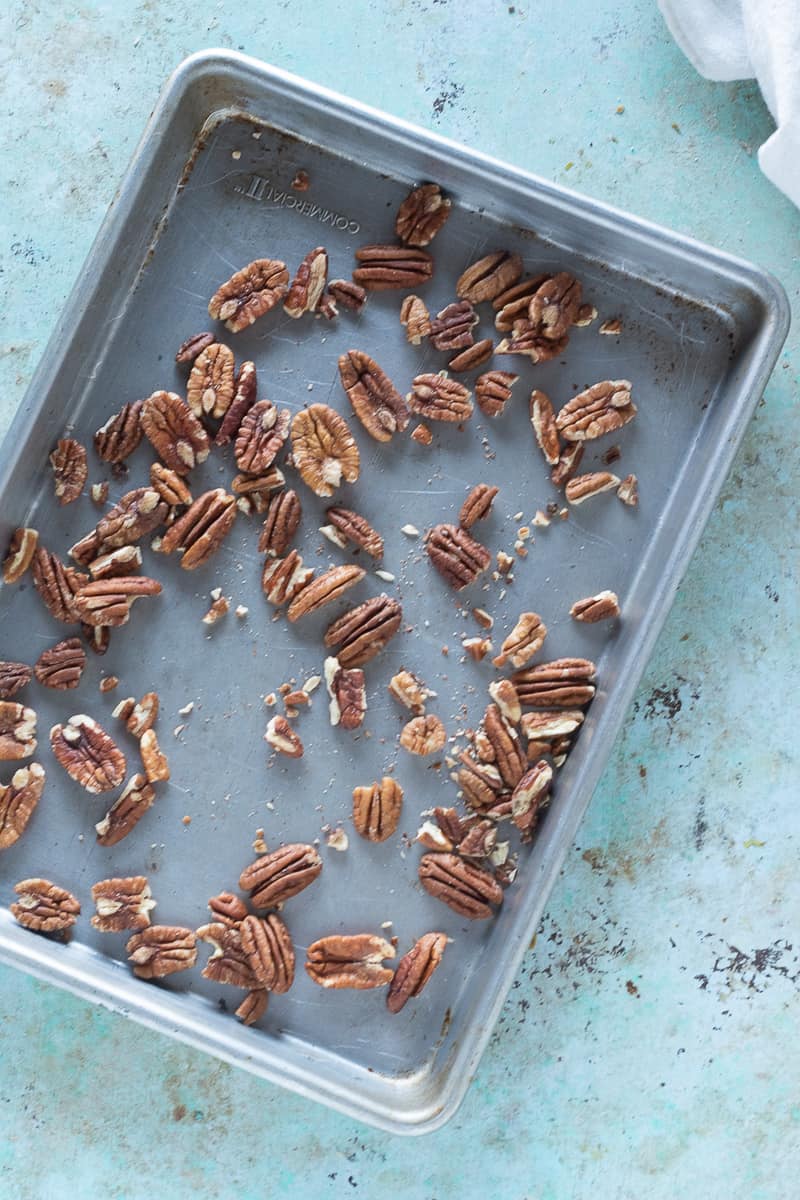 Raw pecans on sheet pan