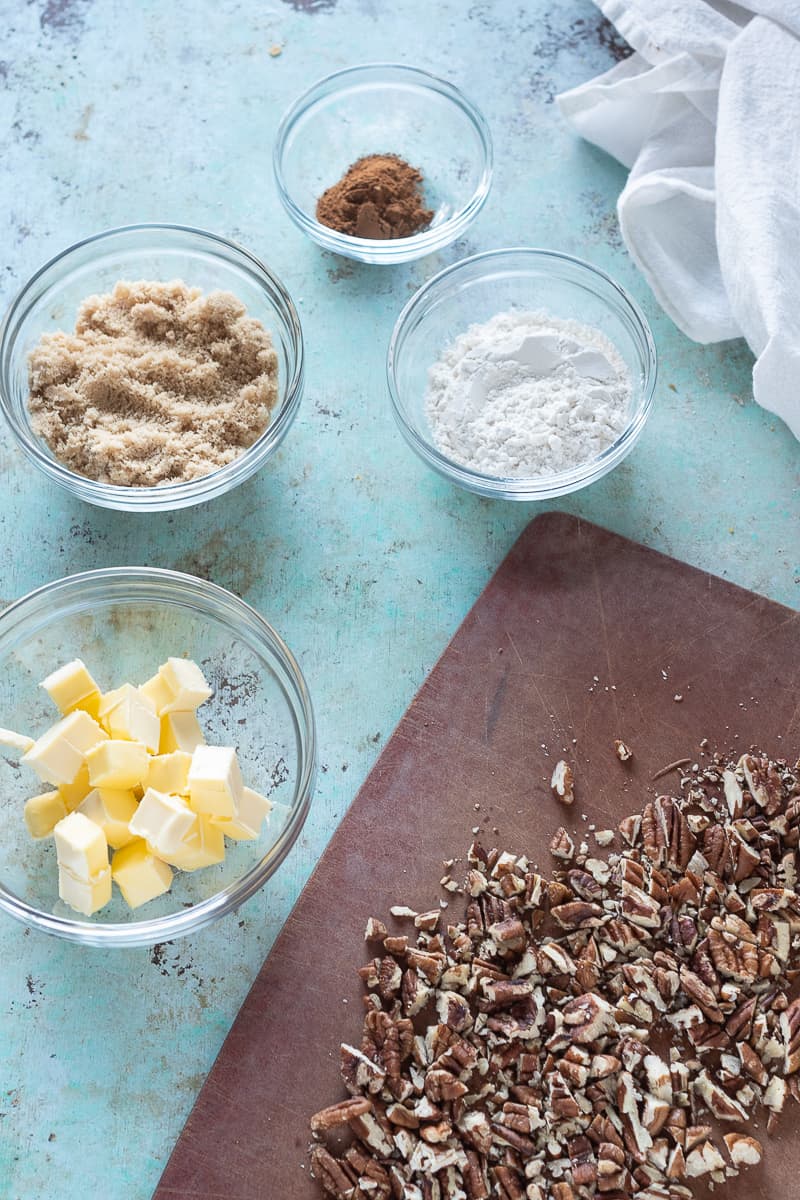 Cubes of butter, brown sugar, cinnamon, flour, and chopped pecans