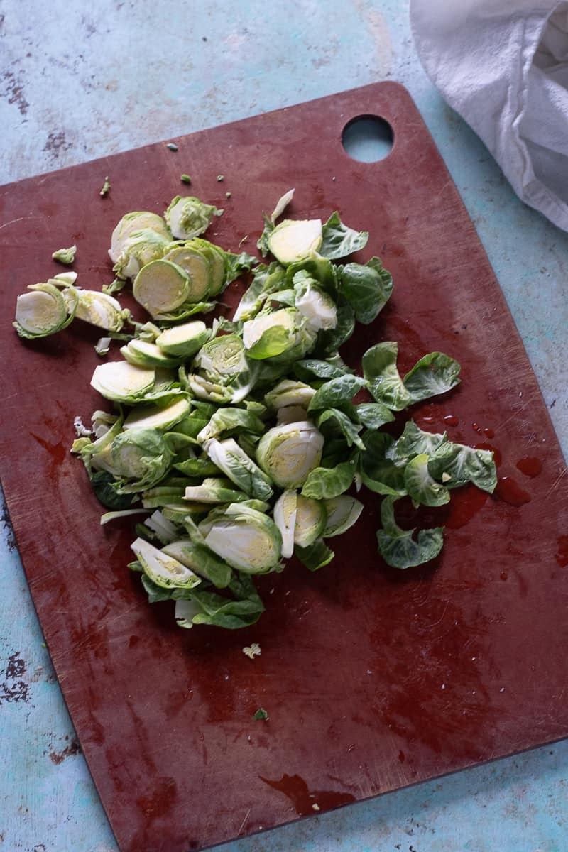 Sliced Brussels sprouts on a cutting board