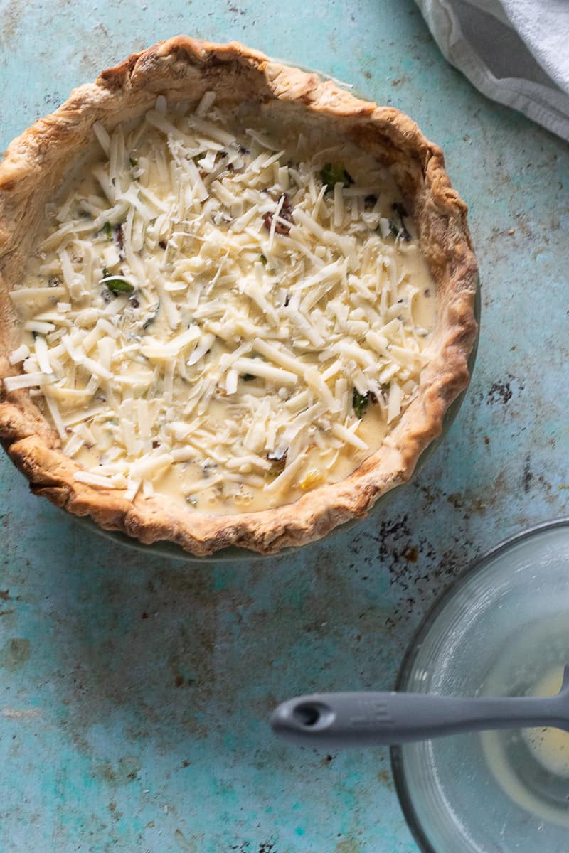 Bacon and Brussels sprout quiche with gruyere waiting to go into the oven