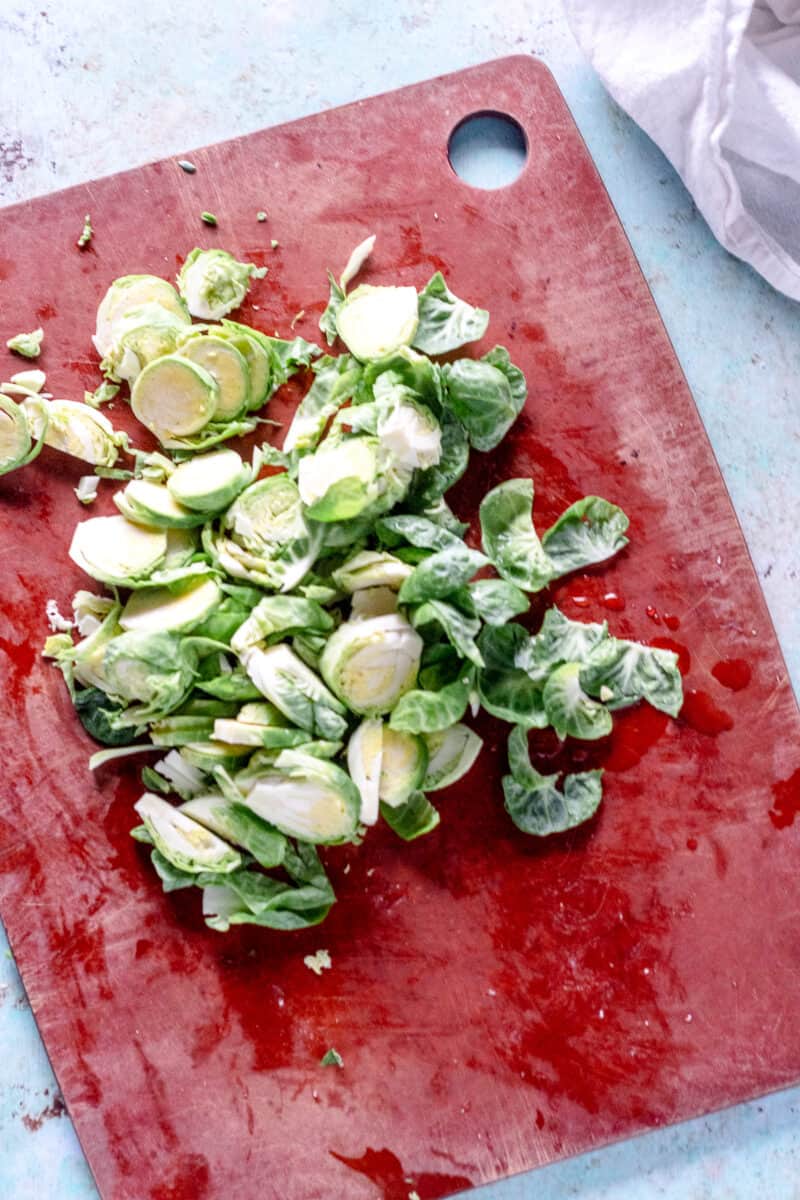 Sliced Brussels sprouts on a cutting board