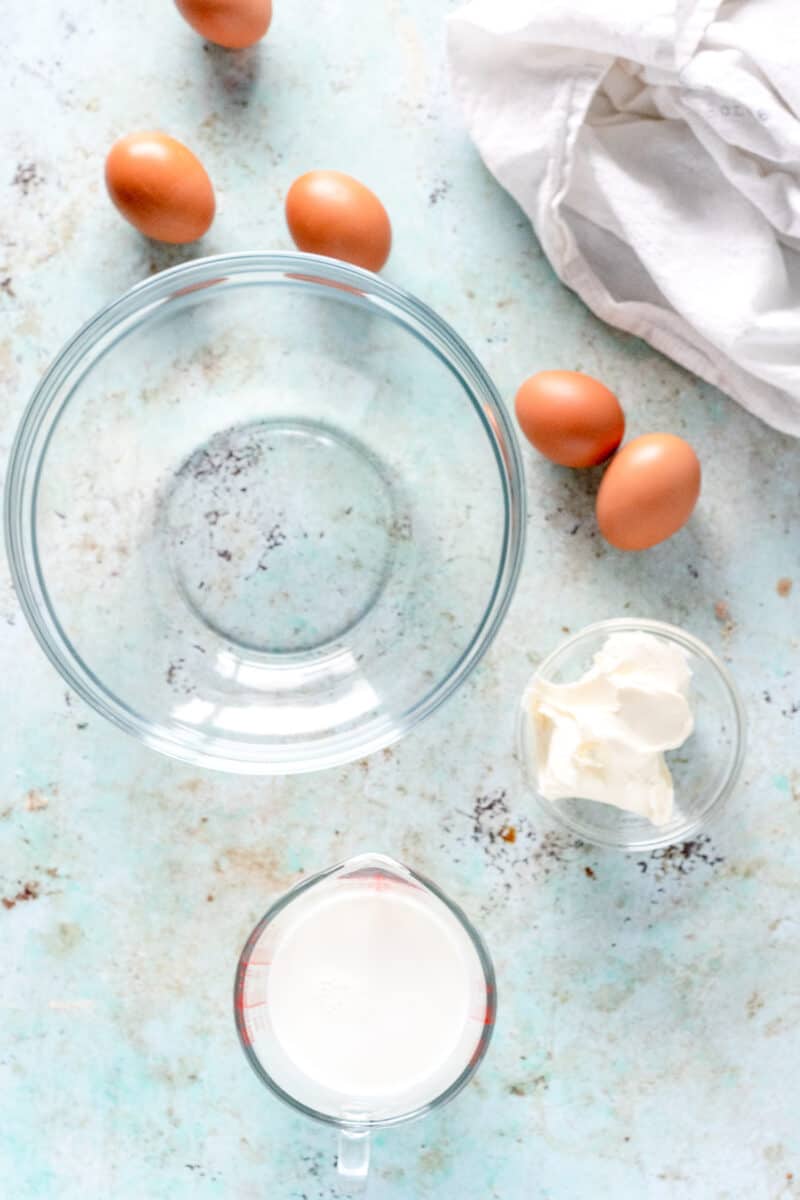 Eggs and milk near a mixing bowl