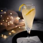 French 75 cocktail with a lemon twist