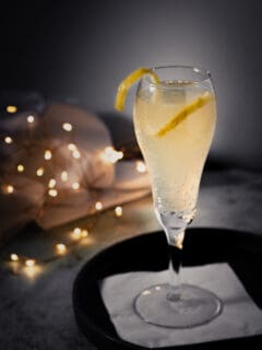 French 75 cocktail with a lemon twist