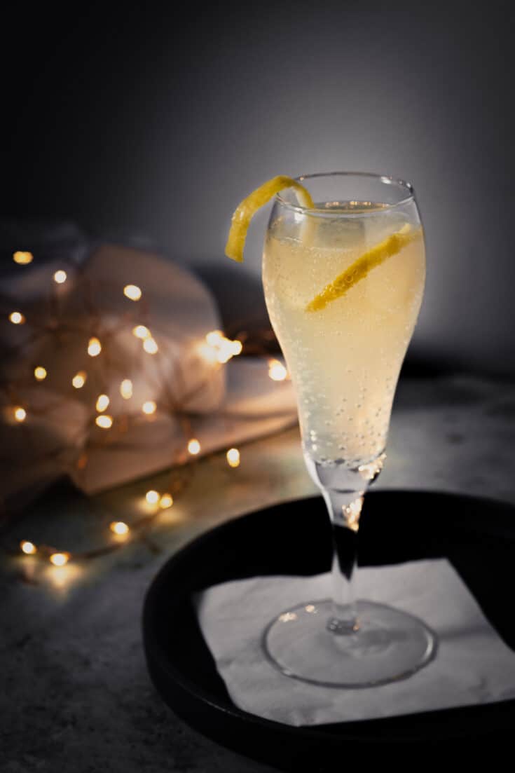 French 75 cocktail with a lemon twist