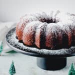 Gingerbread Bundt cake on a black cake stand