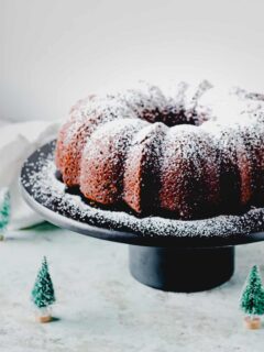 Gingerbread Bundt cake on a black cake stand