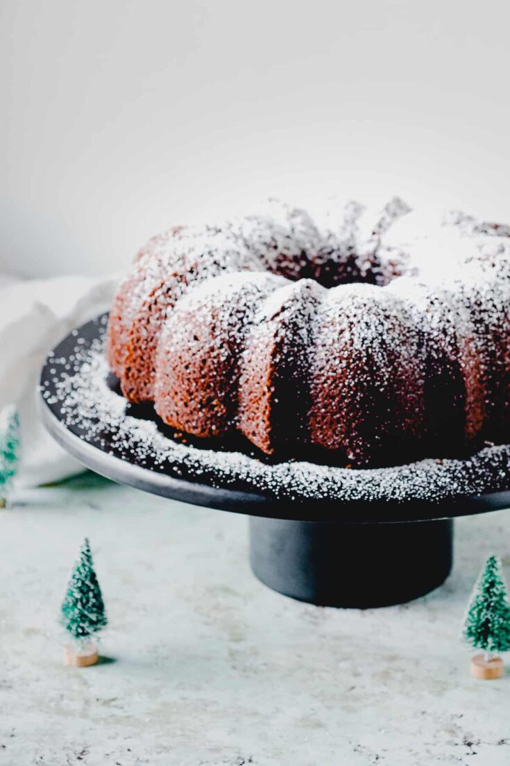 Gingerbread Bundt cake on a black cake stand