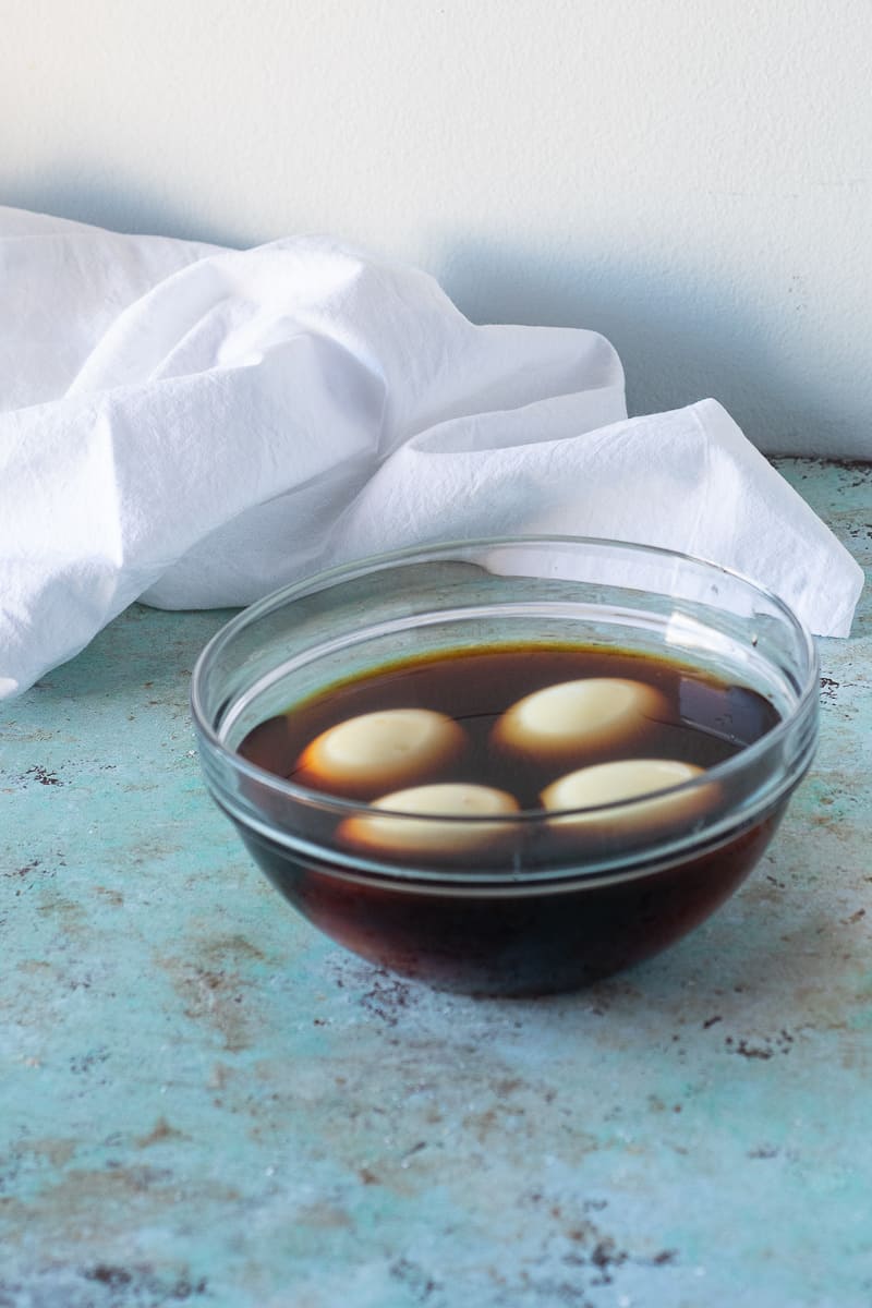 Eggs marinating in soy sauce, mirin, and rice vinegar