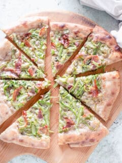 Asparagus Pizza, sliced on a peel