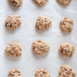 Soft and Chewy Oatmeal Raisin Cookies on parchment paper