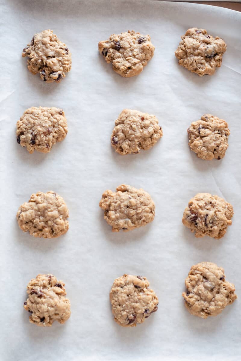 Soft and Chewy Oatmeal Raisin Cookies on parchment paper