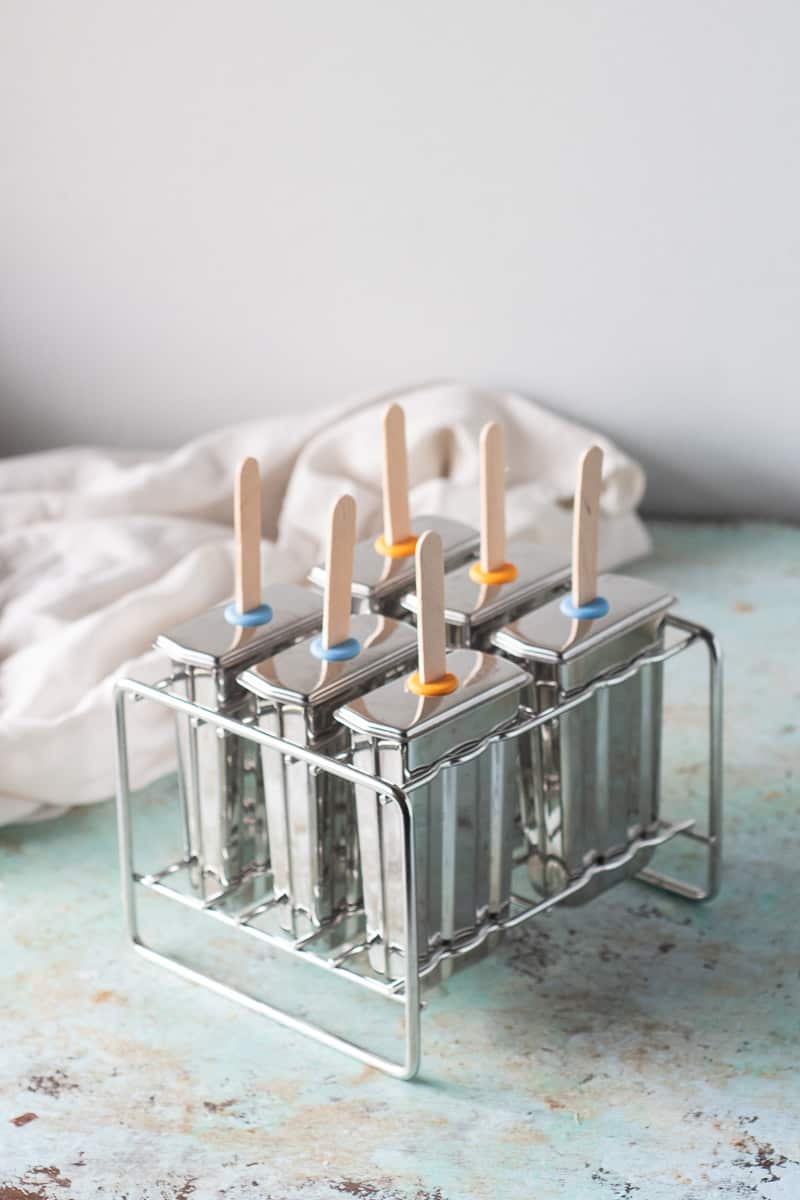 Popsicle molds with popsicle sticks