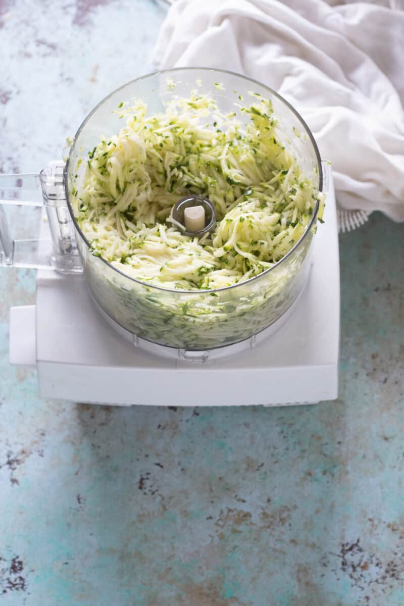 Shredded zucchini in a food processor