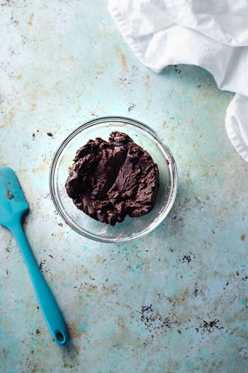 Chocolate shortbread tart dough in a mixing bowl