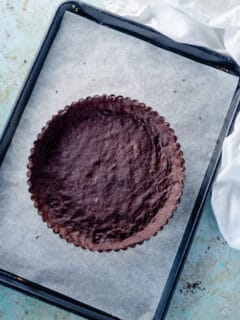 Chocolate Shortbread Tart Crust on a baking sheet