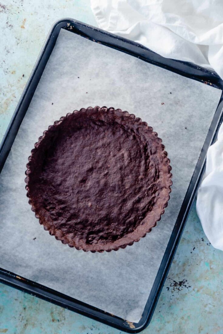 Chocolate Shortbread Tart Crust on a baking sheet