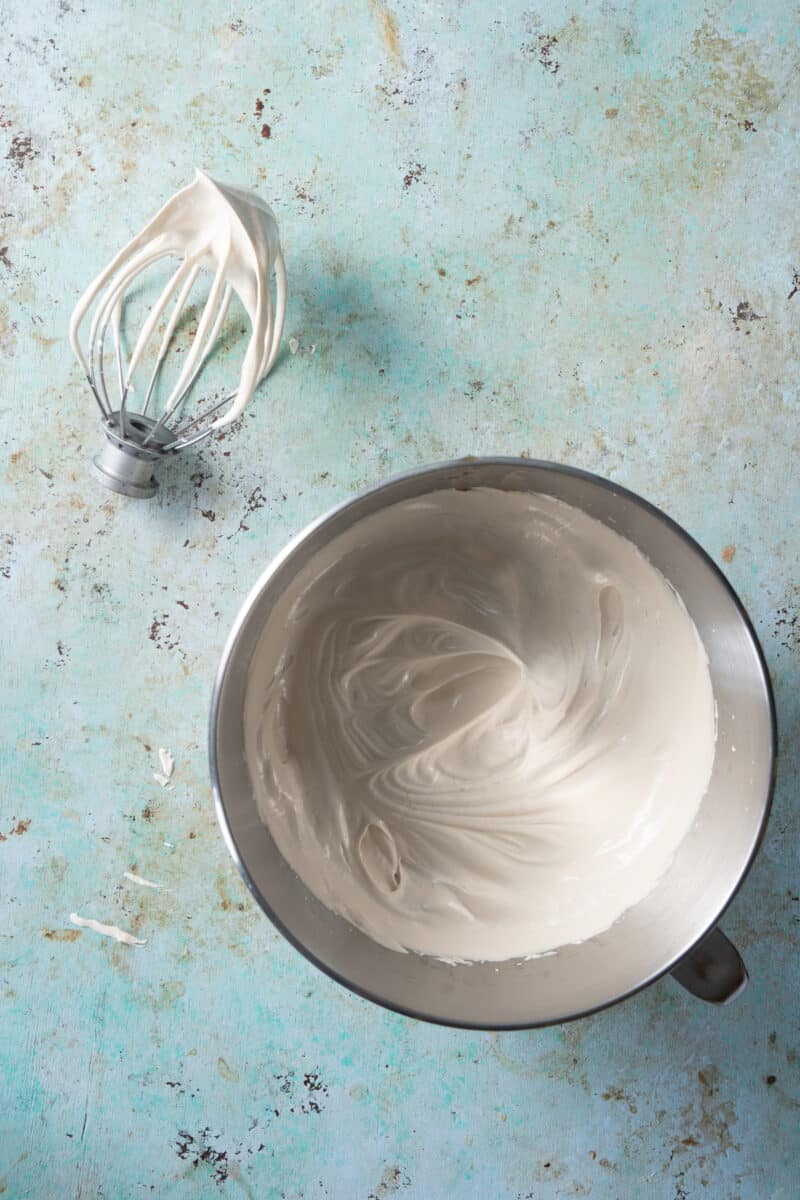 Italian Meringue whipped to medium peaks in the bowl of a stand mixer