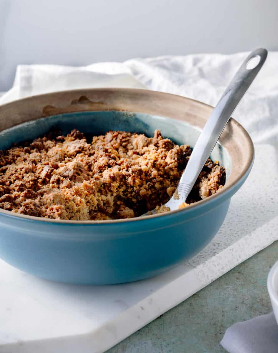 Apple crisp out of the oven in a blue baking dish