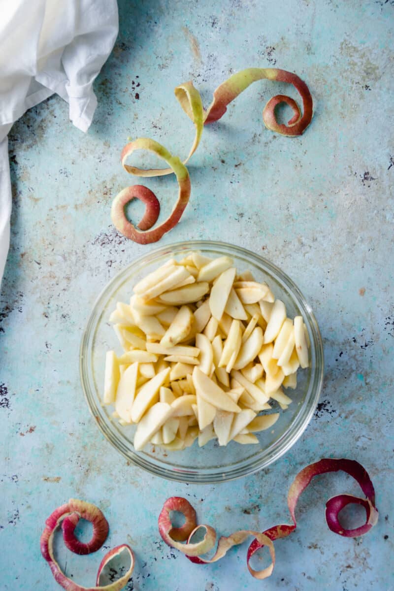 Sliced apples in a mixing bowl