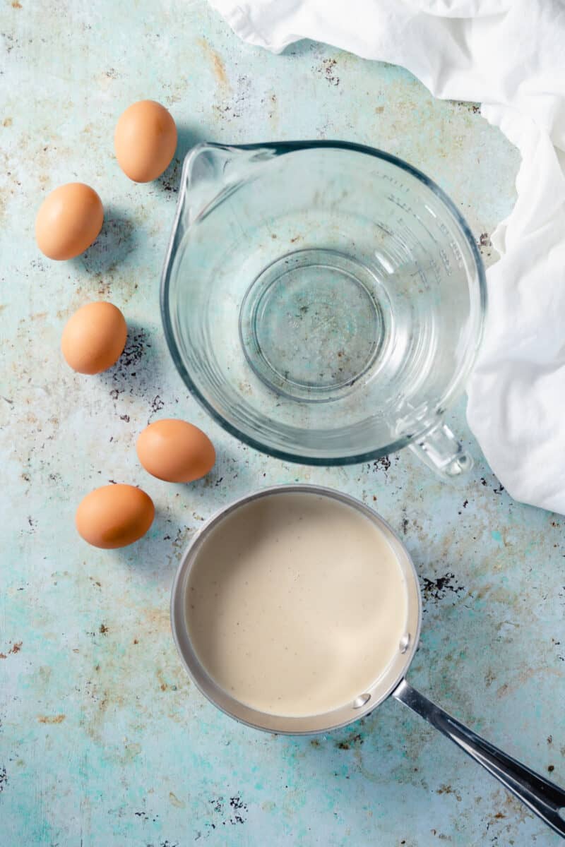 Eggs and banana infused cream next to a mixing bowl