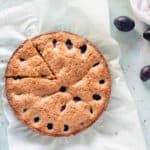 Almond anise plum torte with one slice cut
