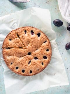 Almond anise plum torte with one slice cut