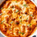 Baked Ziti in an off-white baking dish, close up