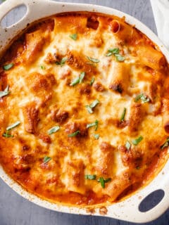 Baked Ziti in an off-white baking dish, close up