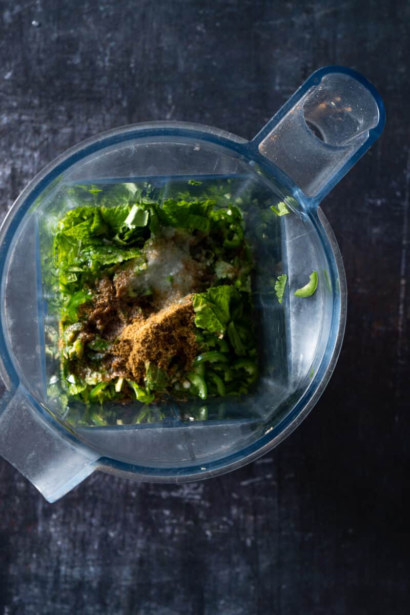 Cilantro chutney ingredients in a blender