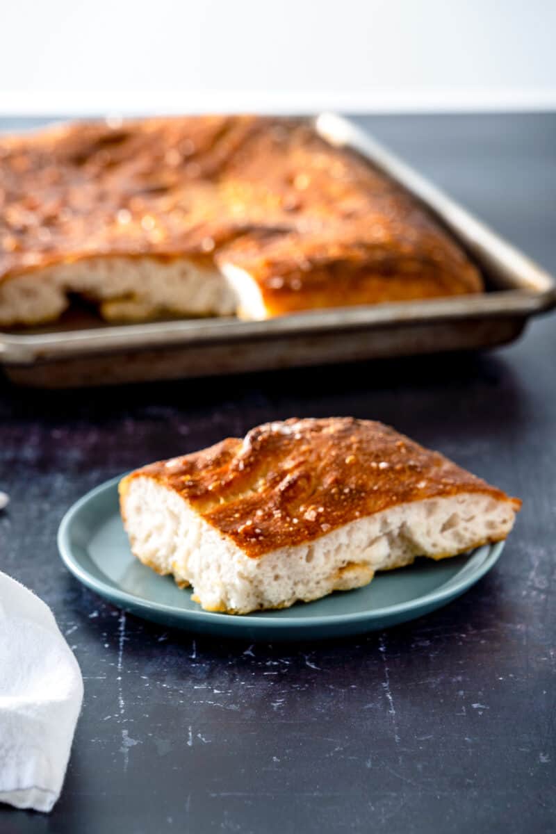 Slice of focaccia on a blue plate