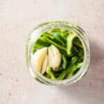 Quick pickled poblano peppers in a mason jar overhead view