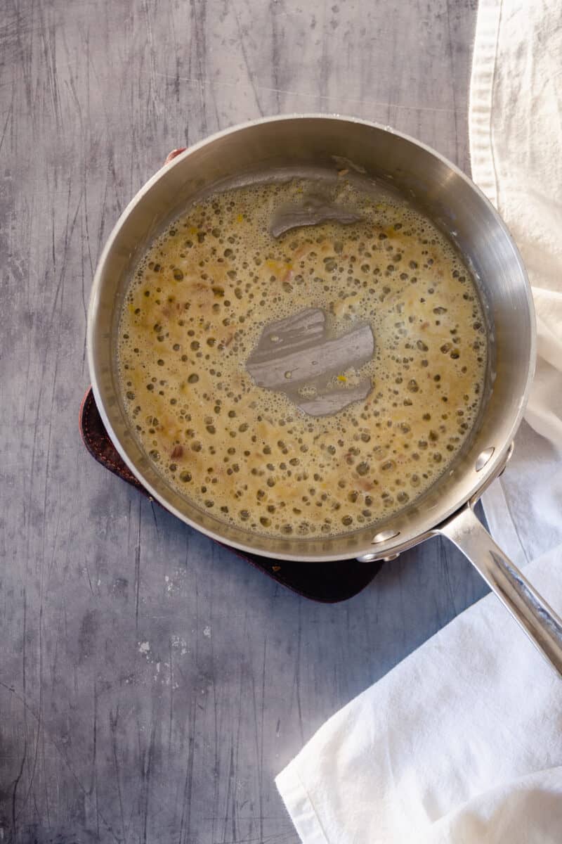 Minced shallots and roux in a saucepan