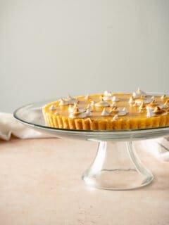 Lemon Ginger Tart on a glass cake stand