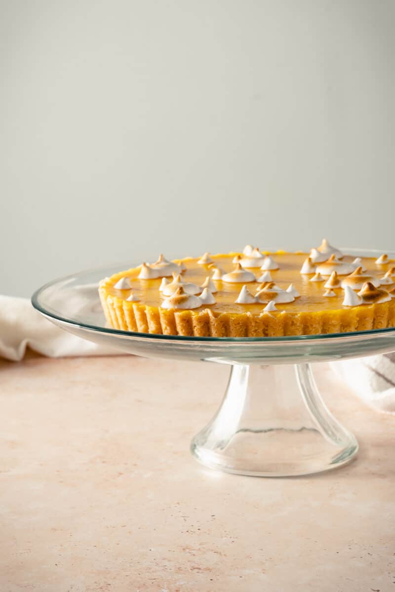 Lemon Ginger Tart on a glass cake stand