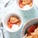 Peach cobbler with ice cream in bowls