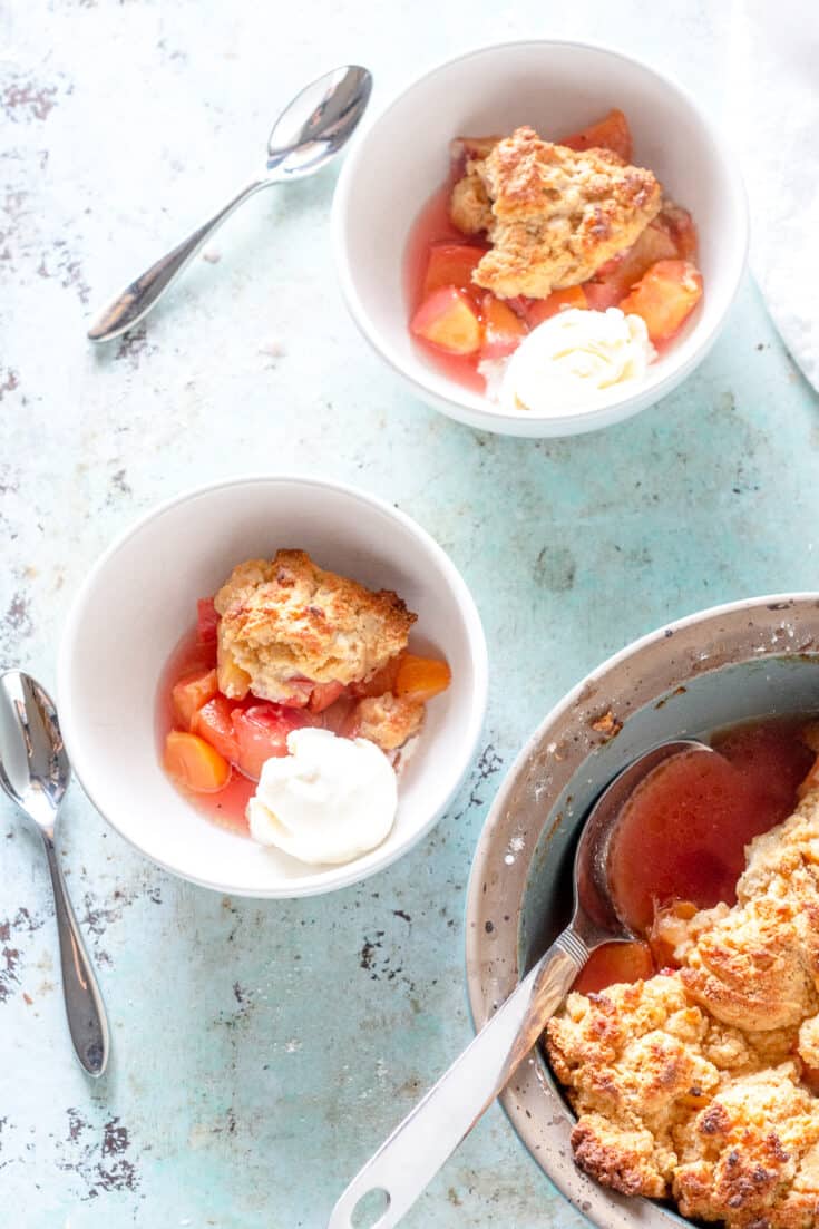 Peach cobbler with ice cream in bowls