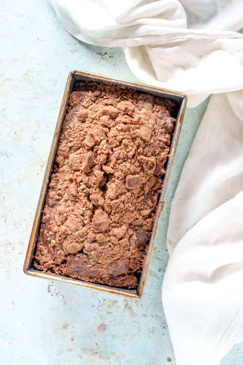 Streusel-topped Banana Bread with Chocolate and Pecans in a loaf pan