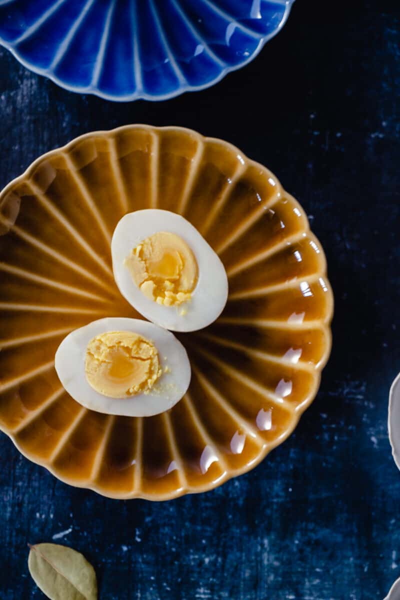 Halved hard boiled egg on a plate