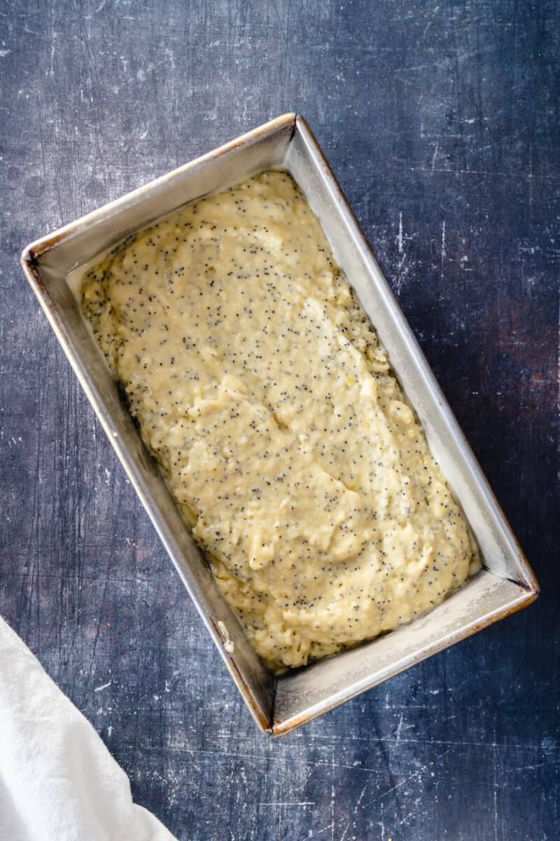 Lemon poppy seed cake batter in a loaf pan